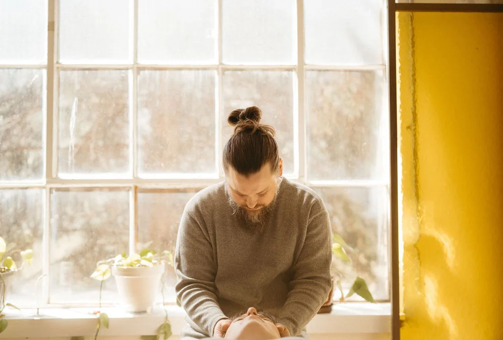 Quiet Reiki room with plants and window light